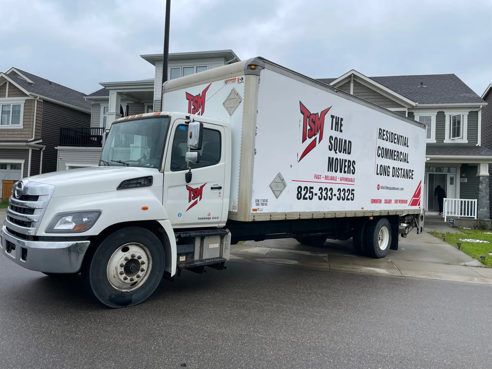 The Squad Movers truck at a home during a full-service move in Edmonton